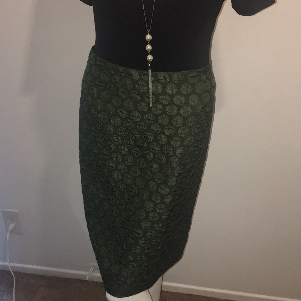 Dark green, knee length skirt, size 10...